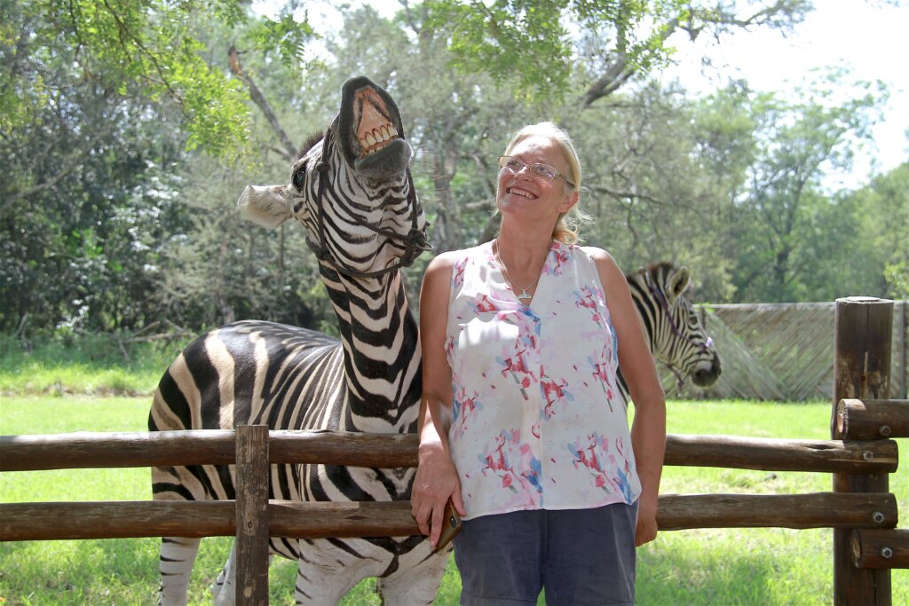 laughing with a zebra